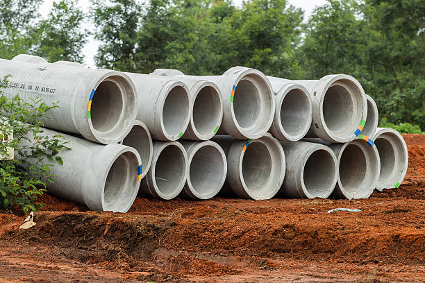 waterdrain seg Concrete water pipes stacked ready for installation on civil engineering construction project site